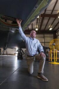 Bo Alksninis, Senior Director of Business Development, highlighting the camera portal for a Gulfstream G-IV.