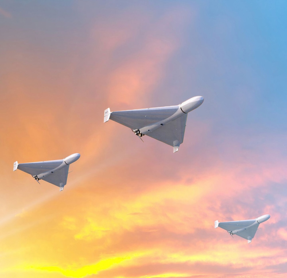 three drones flying in the air